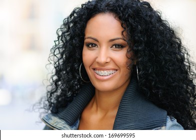 Portrait Of A Young Black Woman Smiling With Braces 