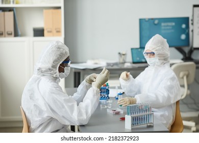 Portrait Of Young Black Woman Wearing Protective Gear While Working In Medical Laboratory