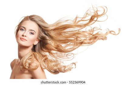 Portrait of a young blond woman with long healthy hair. - Shutterstock ID 552369904
