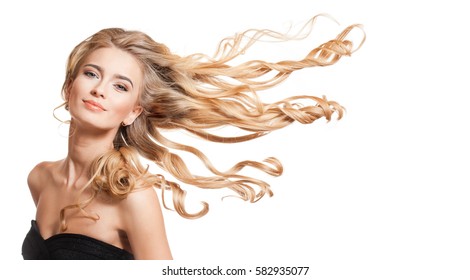 Portrait of a young blond woman with long healthy hair.