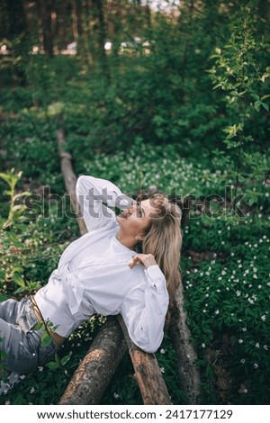 Similar – Woman with sunglasses touching over nature background