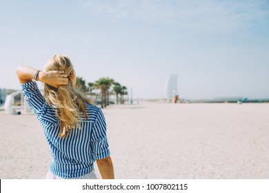 Portrait Of Young Blonde Woman On The Beach