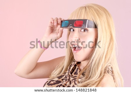 a portrait of a young, blonde woman, smiling with 3d glasses