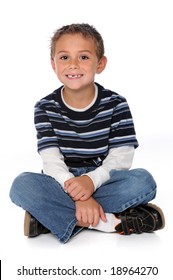 Portrait Of Young Boy Sitting Isolated Over A White Background