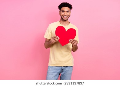 Portrait of young boyfriend guy hold big red paper heart invite girlfriend romance date wear shirt jeans isolated pink color background - Shutterstock ID 2331137837