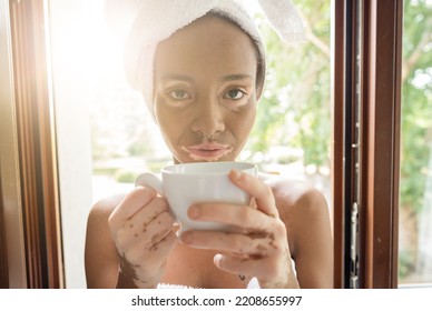 Portrait Of Young Brazilian Woman Girl In Bath Spa Towel And Bathrobe Drinking Detox Drink . Beauty Treatment And Skin Desease