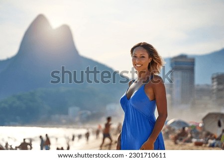 portrait young brazilian woman walking on Ipanema beach in Rio de Janeiro