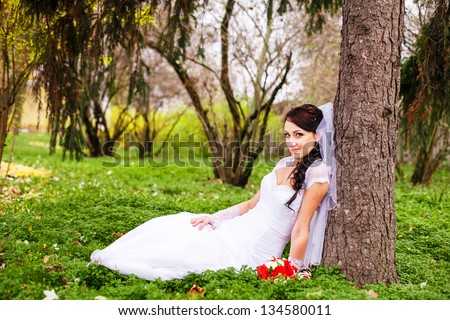  Portrait of an young bride with beautiful wedding hairstyle 	