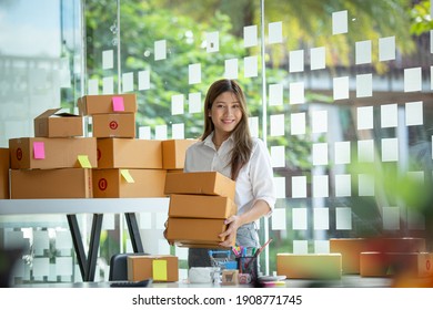 Portrait of young business asian woman online working in office desk use computer copyspace. Success business people employee, freelance SME online marketing work at home, coworking space concept