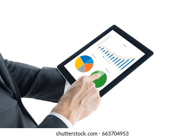 Portrait Of Young Business Man Wear Grey Suit Hold Digital Tablet In Hand And Checking Analyze Data Of Growing Financial Chart Of Sale, Revenue And Profit In Tablet Isolated On White Background