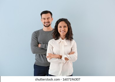 Portrait Of Young Business People On Color Background