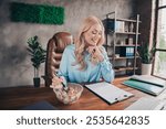 Portrait of young business woman eat lunch read document wear shirt loft interior business center office indoors