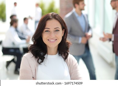 portrait of a young business woman on the background of the offi