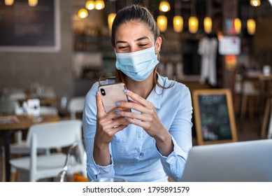 Portrait Of A Young Business Woman, Wearing Mask While Talking On A Mobile Phone. Conceptual Of New Normal Lifestyle During Covid-19 Pandemic.