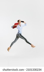 Portrait Of Young Business Woman, Worker Talking On A Phone Isolated Over White Background. Jumping And Dancing Employee. Concept Of Human Emotions, Office, Success, Ballet, Career, Expression, Ad