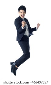 Portrait of young businessman jumping in the air and celebrating his success - Shutterstock ID 466437557