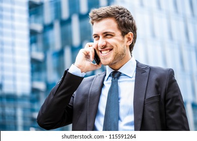 Portrait of a young businessman talking on the phone - Powered by Shutterstock