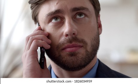 Portrait Of Young Businessman Talking Phone At Remote Office. Focused Man Discussing On Cellphone In Slow Motion. Closeup Handsome Guy Calling Mobile Phone At Home Office.