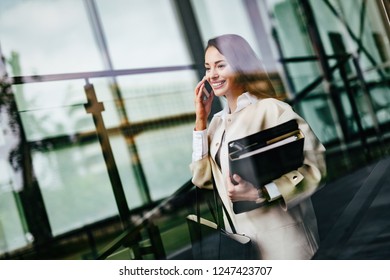 Portrait of young businesswoman going to office - Shutterstock ID 1247423707