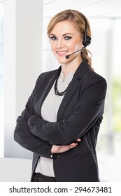 A Portrait Of A Young Businesswoman With A Headphone. Call Centre Or Costumer Service