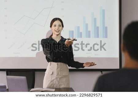 Portrait young businesswoman presentation marketing and profit with confident at office, investment and seminar for planning of finance, business woman standing explaining chart and graph