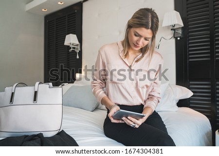 Similar – Image, Stock Photo Young woman in hotel corridor