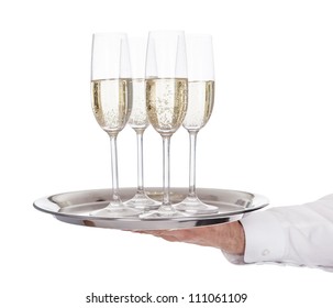 Portrait of a young butler with champagne glass. Isolated on white