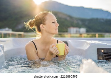 Portrait of young carefree happy smiling woman relaxing at hot tub during enjoying happy traveling moment vacation life against the background of green big mountains - Powered by Shutterstock