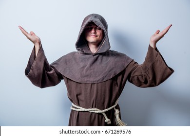 Portrait Of Young Catholic Monk On White Background