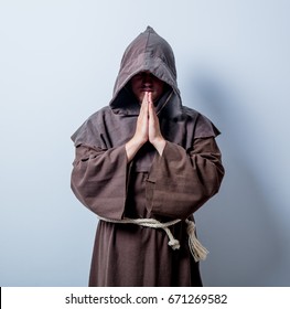 Portrait Of Young Catholic Monk On White Background