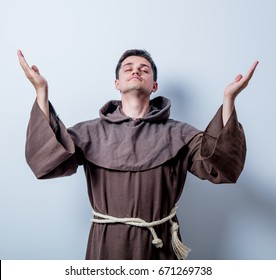 Portrait Of Young Catholic Monk On White Background