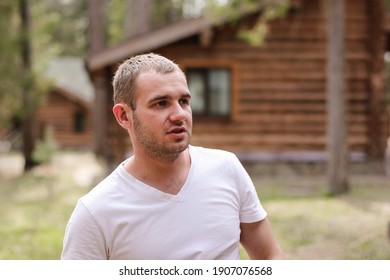 Portrait Of Young Caucasian Man In Plain T-shirt Outdoors. Rest, Vacation In The Country Concept.