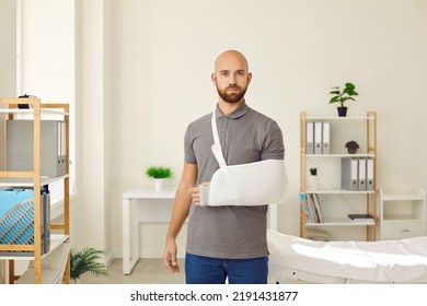 Portrait Of Young Caucasian Man With Splint On Arm After Accident Or Trauma. Male Patient With Bandage Or Sling On Hand Or Shoulder Struggle With Injury Have Rehabilitation. Recovery And Rehab.