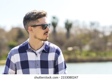 Portrait Of Young Caucasian Man With Sunglasses And Nose Piercing