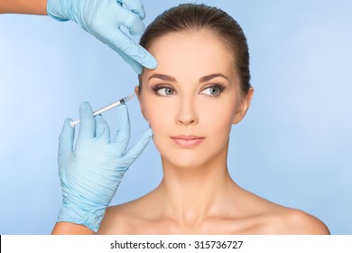 Portrait of young Caucasian woman getting cosmetic injection - Powered by Shutterstock