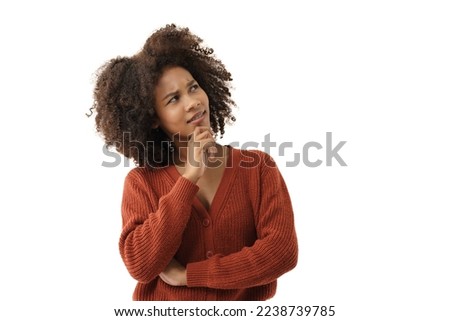 Portrait of young charming Asian woman looks pensive and curious thinking up and look sideways at white background with copy space to the left, concept pensive thought woman, curious thinking woman.
