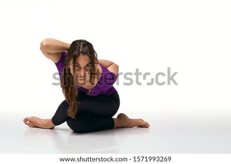 Similar – Image, Stock Photo Woman stretching on yoga mat in a yoga studio