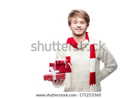 portrait of young cheerful smiling caucasian man which holding christmas gifts with happy smile