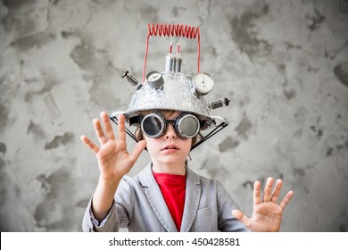 Portrait Of Young Child Pretend To Be Businessman. Nerd Kid With Toy Virtual Reality Headset. Child Geek Playing At Home. Kid Having Fun Indoors. Success, Creative And Innovation Technology Concept