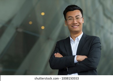 Portrait Of Young Chinese Businessman Looking At Camera Smile