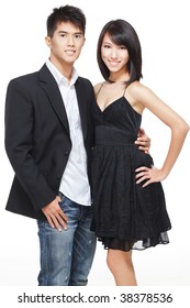 Portrait Of Young, Chinese Working Couple Dressed Up For Date And Party. Shot In Studio Isolated On White