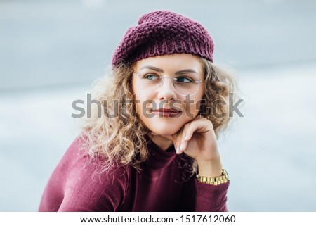 Portrait of young and clever woman with sunglasses posing, fashion concept.