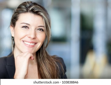 Portrait of a young confident business woman smiling