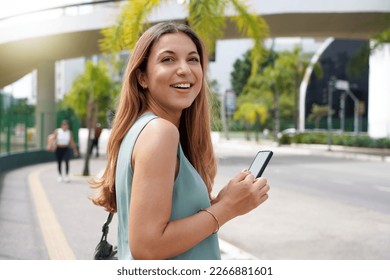 Portrait of young confident entrepreneur turns around in modern sustainable city - Shutterstock ID 2266881601