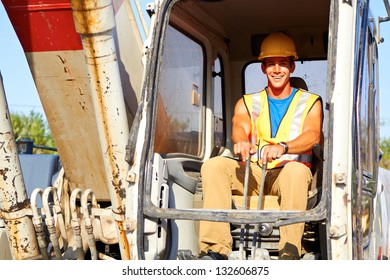 Portrait Of Young Construction Worker Driving Forklift, Front View