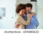 Portrait of young couple feeling happy about buying a new house.