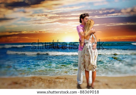 Portrait of young couple in love embracing at beach and enjoying time being together. Idealistic artistic  photo poster for advertisement banner