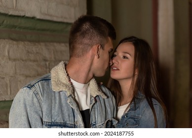 Portrait Of Young Couple In Love Looking At Each Other. Young Couple On Evening Romantic Date. Night City.