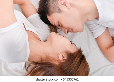 portrait of young couple of lovers in bed