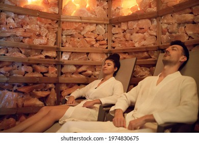 Portrait of young couple in salt inhalation steam room, relaxing.